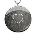 Selenite Silver Heart by Orgonise Africa – round dark grey pendant with a silver heart outline over clear crystal shards, on a grey cord