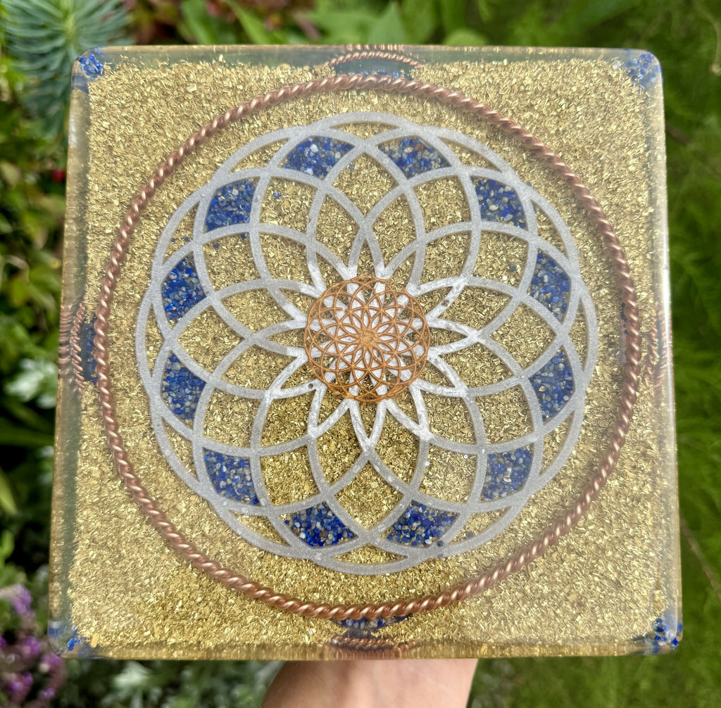 Base of the pyramid: a large silver Torus pattern inlaid with Lapis Lazuli over brass flakes, framed by a twisted copper ring