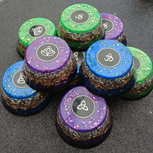 Colourful Orgonite Towerbuster Cupcakes by Orgone Art Yvonne – small round cupcake shapes in green, purple and blue with silver symbol discs on top and layered metal bases