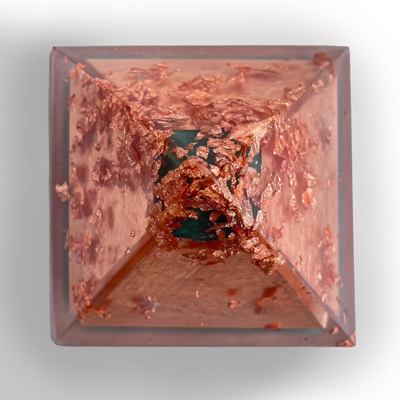 Top-down view of the pyramid showing copper flakes on each face around a green centre