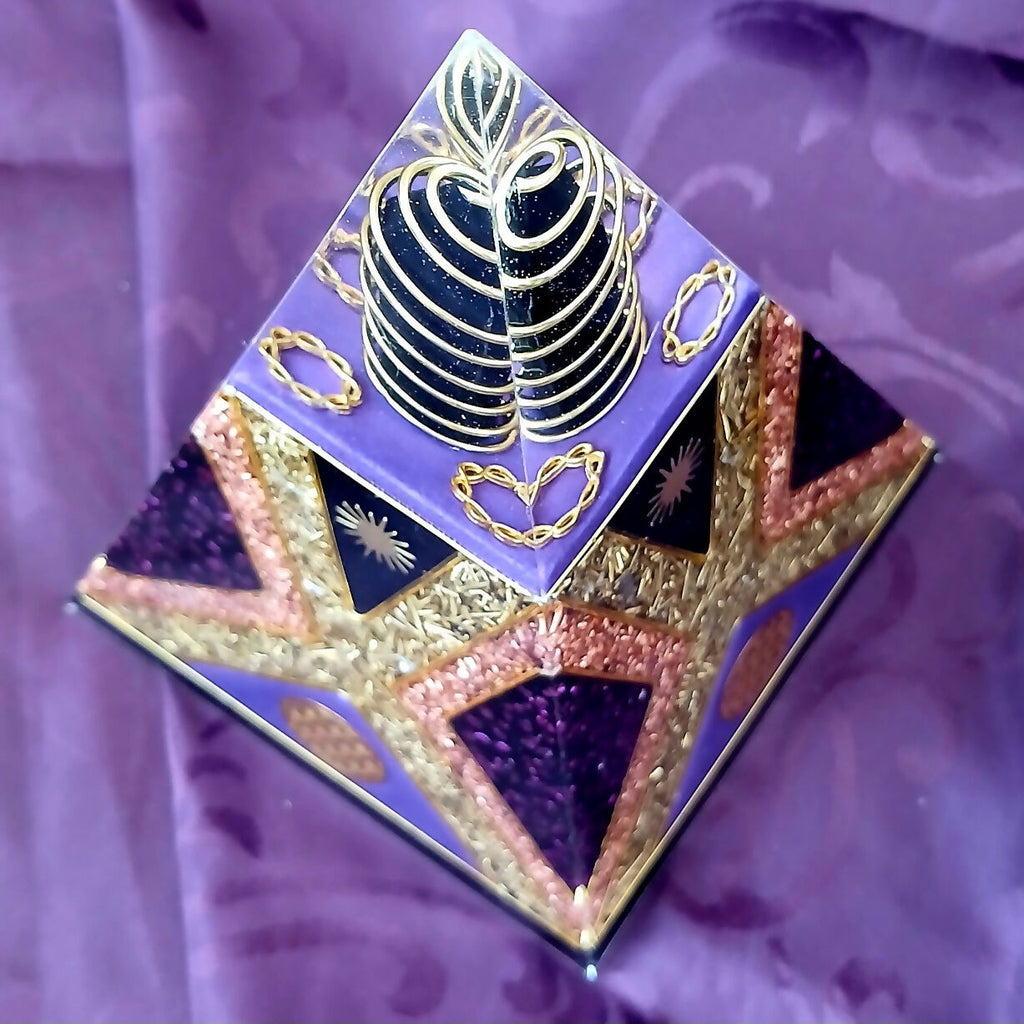 Angled view from above showing the gold ring coil around the dark centre and copper-edged star panels