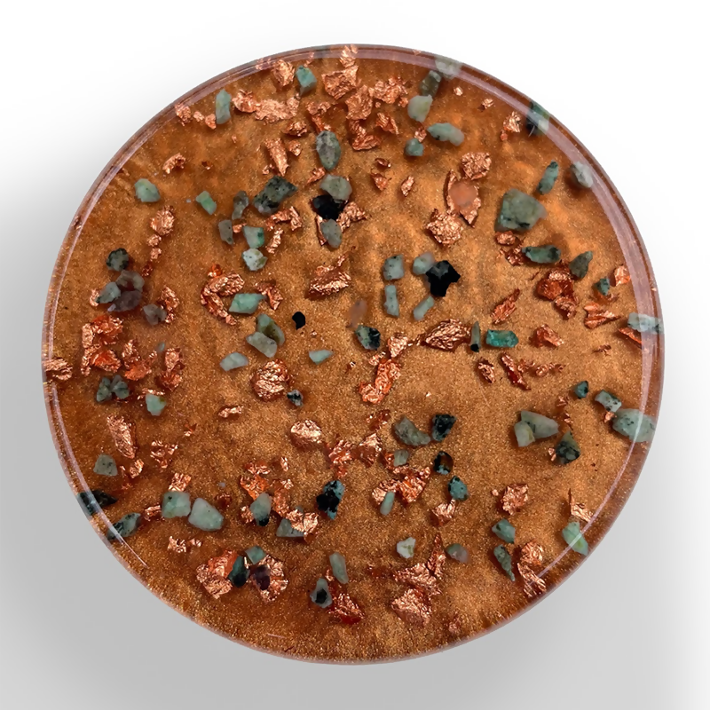 Top view of the copper-coloured surface with green stone chips and copper flakes
