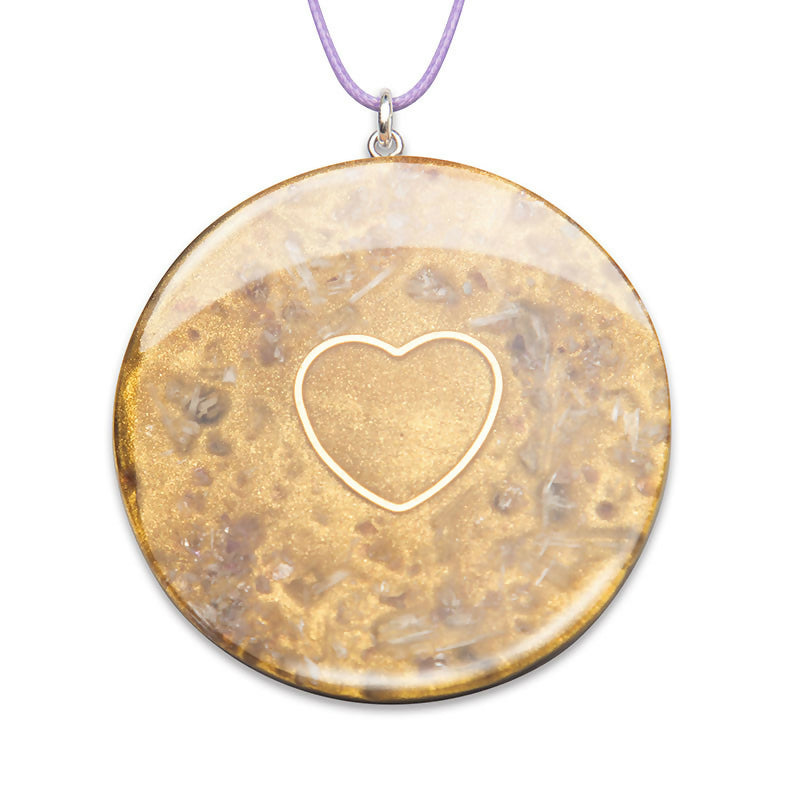 Selenite Golden Heart by Orgonise Africa – round gold-toned pendant with a heart outline in the centre, on a lilac cord