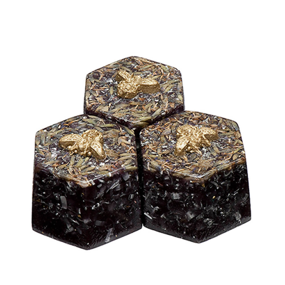 Set of three hexagonal Beehive Boosters, with dark lower sections and gold-coloured flecks across the tops