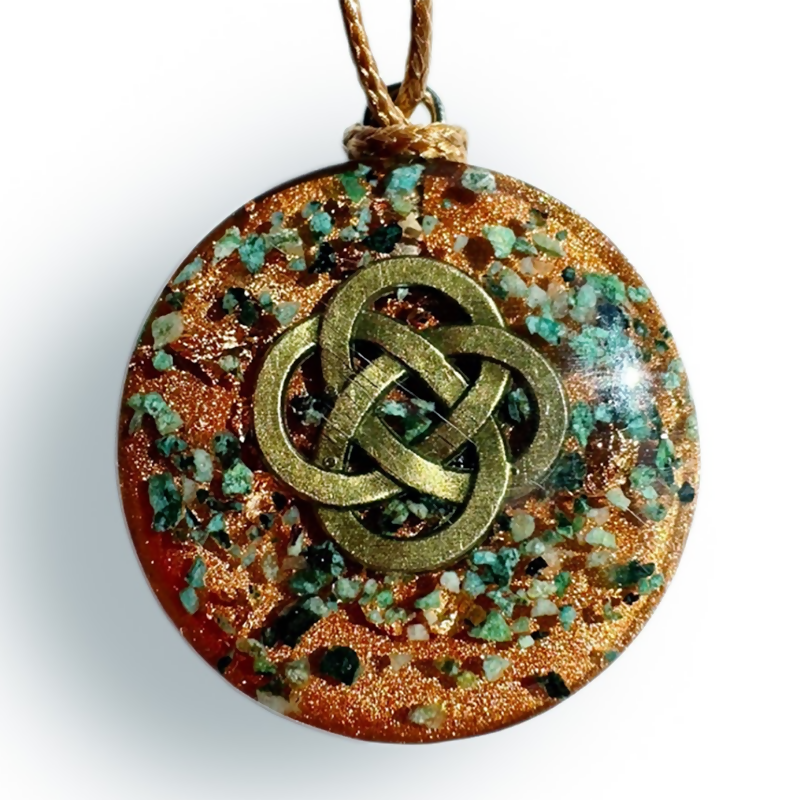 Copper Orgonite Pendant by Orgonise Africa – round copper-glitter pendant with green stone chips and a bronze Celtic knot on the front, on a brown cord