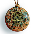 Copper Orgonite Pendant by Orgonise Africa – round copper-glitter pendant with green stone chips and a bronze Celtic knot on the front, on a brown cord