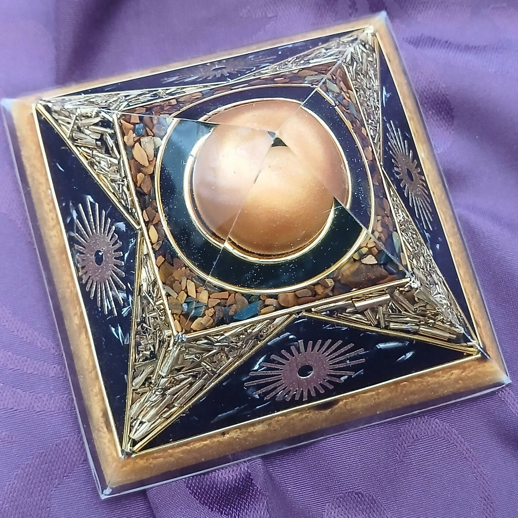 Angled top view showing the golden-brown sphere ringed with brown chips and gold star-shaped edges